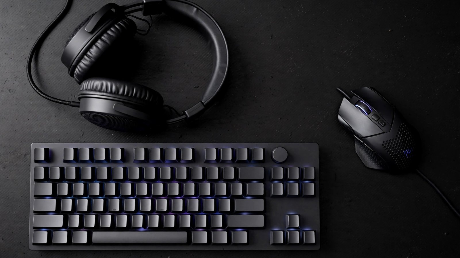 Illustration of a wireless gaming mouse next to a laptop with a clean desk setup and soft blue light